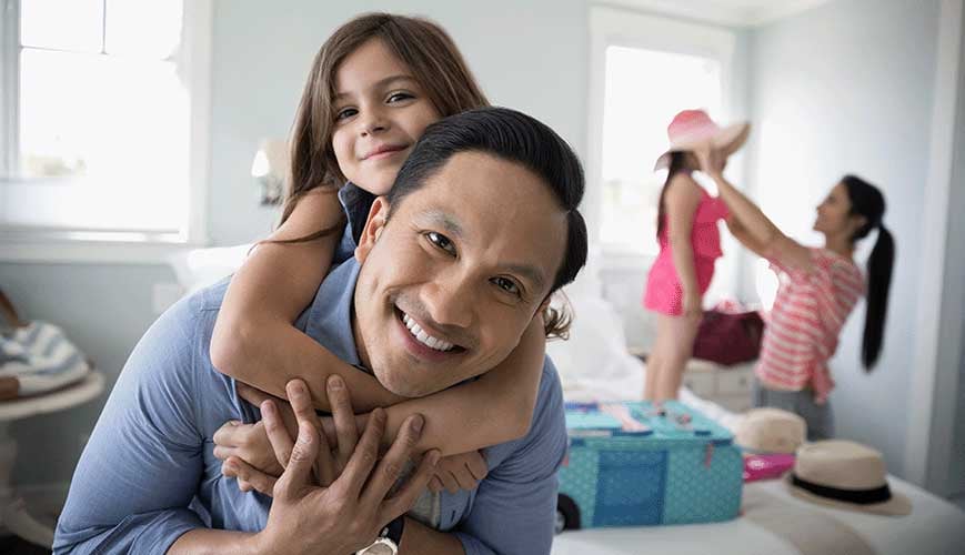 Family Enjoying Vacation in Hotel Room