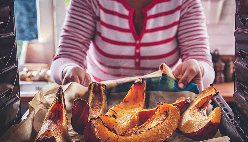 Mother Cooking Pumpkin on Thanksgiving