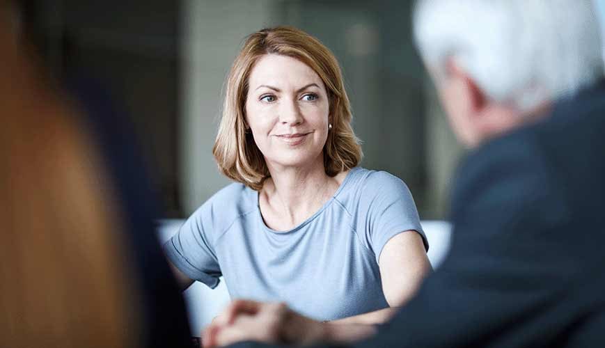 Woman Sitting Having a Conversation