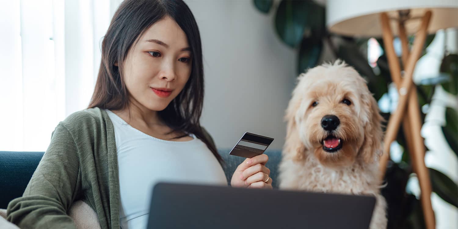 Woman researching wellness purchases online to spend smarter on health and self care